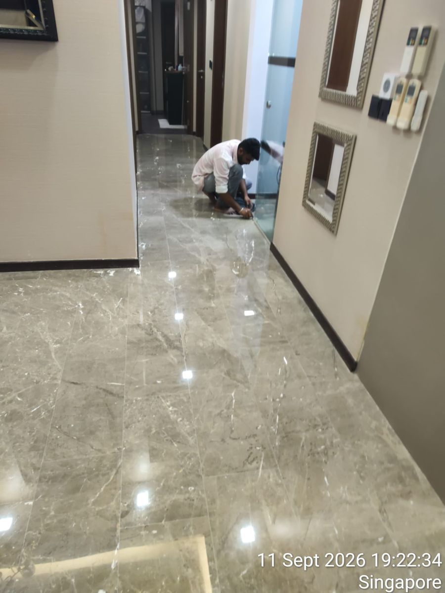 Hand polishing marble along the skirting