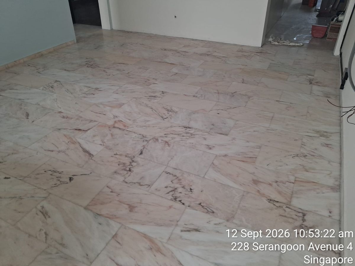 Pink marble tiles across a bedroom